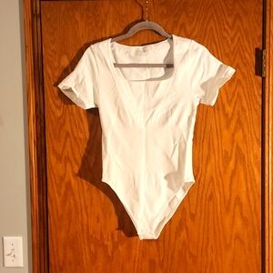 NWOT white size large bodysuit meant to serve as shapewear as well.